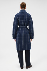 Profile view of model wearing the Oroton Sunday Check Mac in North Sea and 100% cotton fabric for Women .