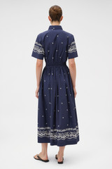 Profile view of model wearing the Oroton Floral Bandana Shirt Dress in North Sea and 100% cotton fabric for Women .
