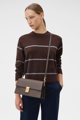 Profile view of model wearing the Oroton Yvonne Shoulder Bag in Coffee Bean and Premium pebble leather for Women .