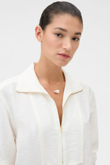 Profile view of model wearing the Oroton Marleigh Pearl Pendant in Worn Gold/White and Brass material for Women .