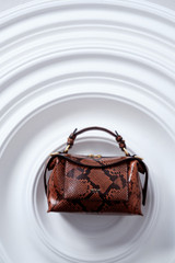 Detail product shot of the Oroton Mica Bowler in Copper Snake and Premium pebble grain leather for Women .
