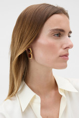 Profile view of model wearing the Oroton Lilyanna Drop Earrings in Tort/Worn Gold and Brass material for Women .