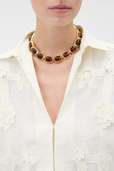 Profile view of model wearing the Oroton Lilyanna Necklace in Tort/Worn Gold and Brass material for Women .