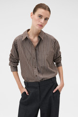 Profile view of model wearing the Oroton Long Sleeve Stripe Shirt in Milk Chocolate and 100% cotton yarn-dyed shirting stripe fabric for Women .