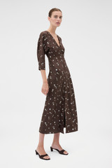 Profile view of model wearing the Oroton Mini Daisy Day Dress in Milk Chocolate and 100% silk twill fabric for Women .