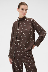 Profile view of model wearing the Oroton Mini Daisy Tie Neck Tunic in Milk Chocolate and 100% silk twill fabric for Women .