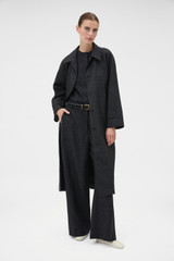 Profile view of model wearing the Oroton Wool Mac in Dark Charcoal and 100% wool fabric for Women .