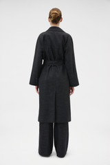 Profile view of model wearing the Oroton Wool Mac in Dark Charcoal and 100% wool fabric for Women .