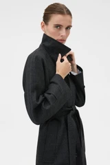 Profile view of model wearing the Oroton Wool Mac in Dark Charcoal and 100% wool fabric for Women .