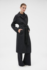 Profile view of model wearing the Oroton Wool Mac in Dark Charcoal and 100% wool fabric for Women .