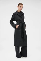 Profile view of model wearing the Oroton Wool Mac in Dark Charcoal and 100% wool fabric for Women .