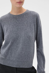 Profile view of model wearing the Oroton Scarf Knit in Grey Marle and 100% mid-gauge Merino wool fabric for Women .