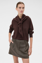 Profile view of model wearing the Oroton Scarf Knit in Dark Chocolate and 100% mid-gauge Merino wool fabric for Women .