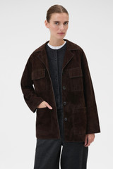 Profile view of model wearing the Oroton Suede Jacket in Dark Chocolate and 100% suede leather for Women .