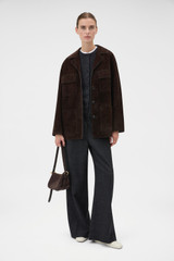 Profile view of model wearing the Oroton Suede Jacket in Dark Chocolate and 100% suede leather for Women .