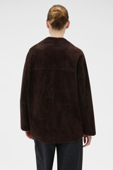 Profile view of model wearing the Oroton Suede Jacket in Dark Chocolate and 100% suede leather for Women .