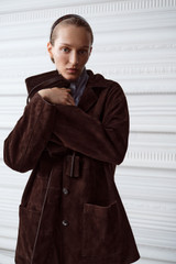 Profile view of model wearing the Oroton Suede Jacket in Dark Chocolate and 100% suede leather for Women .