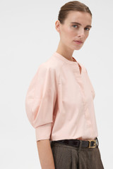 Profile view of model wearing the Oroton Sleeve Detail Shirt in Rose Tint and 100% cotton poplin fabric for Women .