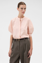 Profile view of model wearing the Oroton Sleeve Detail Shirt in Rose Tint and 100% cotton poplin fabric for Women .