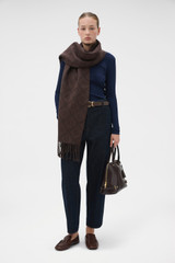 Profile view of model wearing the Oroton Harvey Signature Two Tone Scarf in Umber/Burnt Umber and 50% wool and 50% acrylic blend fabric for Women .