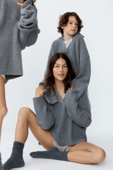 Profile view of model wearing the Oroton Rib Knit Popover in Grey Marle and 100% superfine wool fabric for Women .