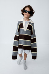 Profile view of model wearing the Oroton Rugby Stripe Knit in Dark Chocolate and 100% superfine wool fabric for Women .