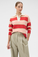 Profile view of model wearing the Oroton Rugby Stripe Knit in Soft Red and 100% superfine wool fabric for Women .