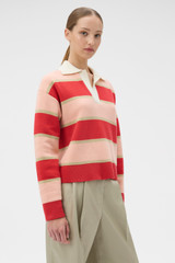 Profile view of model wearing the Oroton Rugby Stripe Knit in Soft Red and 100% superfine wool fabric for Women .
