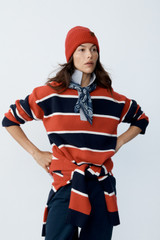 Profile view of model wearing the Oroton Rugby Stripe Knit in North Sea and 100% superfine wool fabric for Women .