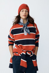 Profile view of model wearing the Oroton Rugby Stripe Knit in North Sea and 100% superfine wool fabric for Women .