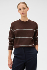Profile view of model wearing the Oroton Stripe Knit Pullover in Dark Chocolate and 100% superfine wool fabric for Women .