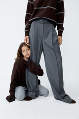 Profile view of model wearing the Oroton Rib Knit Popover in Dark Chocolate and 100% superfine wool fabric for Women .
