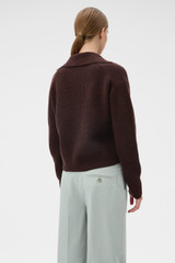 Profile view of model wearing the Oroton Rib Knit Popover in Dark Chocolate and 100% superfine wool fabric for Women .