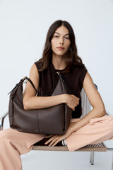 Profile view of model wearing the Oroton Knit Detail Vest in Dark Chocolate and 100% superfine wool fabric for Women .