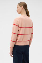 Profile view of model wearing the Oroton Stripe Knit Pullover in Peach and 100% superfine wool fabric for Women .