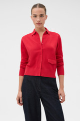 Profile view of model wearing the Oroton Collar Cardigan in Market Red and 100% super soft merino wool fabric for Women .