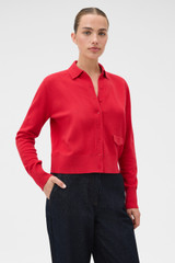 Profile view of model wearing the Oroton Collar Cardigan in Market Red and 100% super soft merino wool fabric for Women .