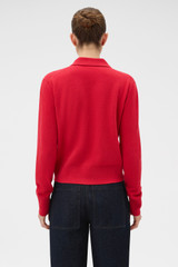 Profile view of model wearing the Oroton Collar Cardigan in Market Red and 100% super soft merino wool fabric for Women .