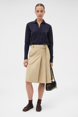 Profile view of model wearing the Oroton Collar Cardigan in North Sea and 100% super soft merino wool fabric for Women .