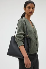 Profile view of model wearing the Oroton Margot Hobo in Black and Premium pebble leather for Women .