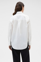 Profile view of model wearing the Oroton Wren Poplin Shirt in Antique White and 100% cotton fabric for Women .
