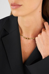 Profile view of model wearing the Oroton Carly Chain Link Necklace in Gold and Primary Material: Brass for Women .
