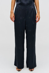 Profile view of model wearing the Oroton Embroidered Leaf Pyjama Pant in Slate and 100% viscose fabric for Women .