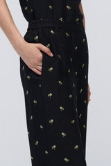 Profile view of model wearing the Oroton Mini Daisy Jacquard Pyjama Pants in Black and Made with 84% viscose and 16% polyester for Women . IP:6