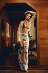 Profile view of model wearing the Oroton Label Print Pyjama Pant in Cream and 100% silk fabric for Women .