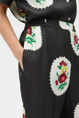 Profile view of model wearing the Oroton Folk Doilie Print Pyjama Pant in Black and 100% silk twill fabric for Women .