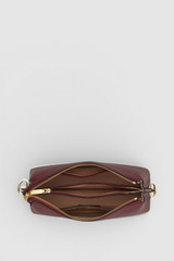 Internal product shot of the Oroton Eve Zip Top Crossbody in BURGUNDY and Premium pebble leather for Women .