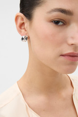Profile view of model wearing the Oroton Ada Knot Studs in SILVER and Brass with sterling silver earring post for Women .