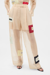 Profile view of model wearing the Oroton Patched Vintage Label Pyjama Pant in Nougat and 100% sheer silk organdy fabric for Women .