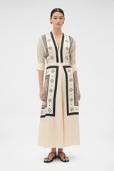Profile view of model wearing the Oroton Spot Scarf Print Dress in Nougat and 100% silk twill fabric for Women .
